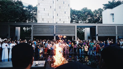 Audience Looking at Flames During Performance