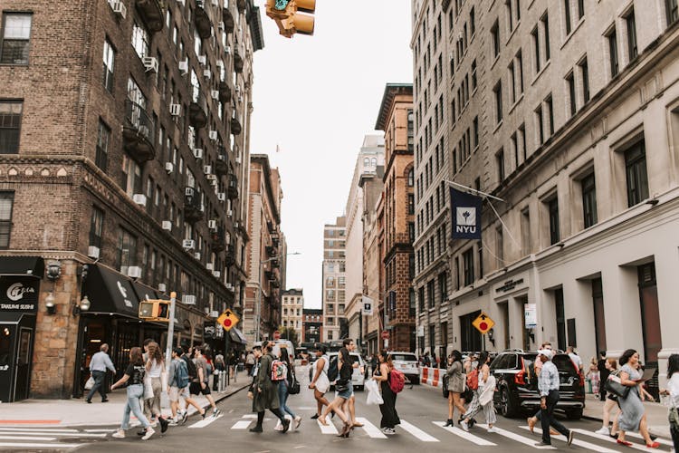 People Crossing A Street In New York 