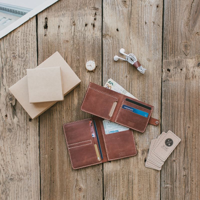 Leather wallet gift set with cards on rustic wood
