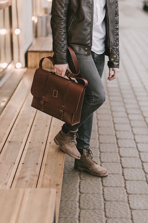 Free Person Holding a Brown Leather Briefcase Stock Photo