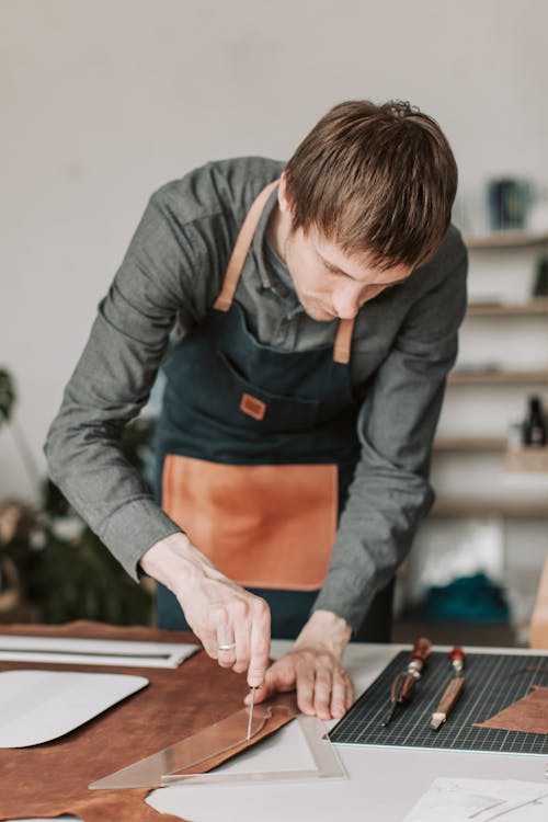 A Leathersmith Cutting Brown Leather Strap 