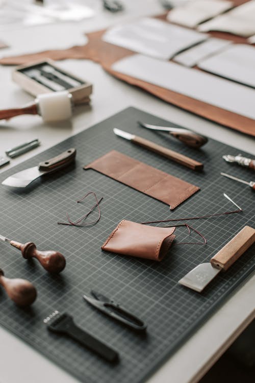 Tools and Leather Lying on a Desk in a Leather Crafting Workshop 