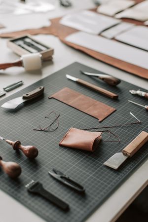 Leather crafting tools on a desk