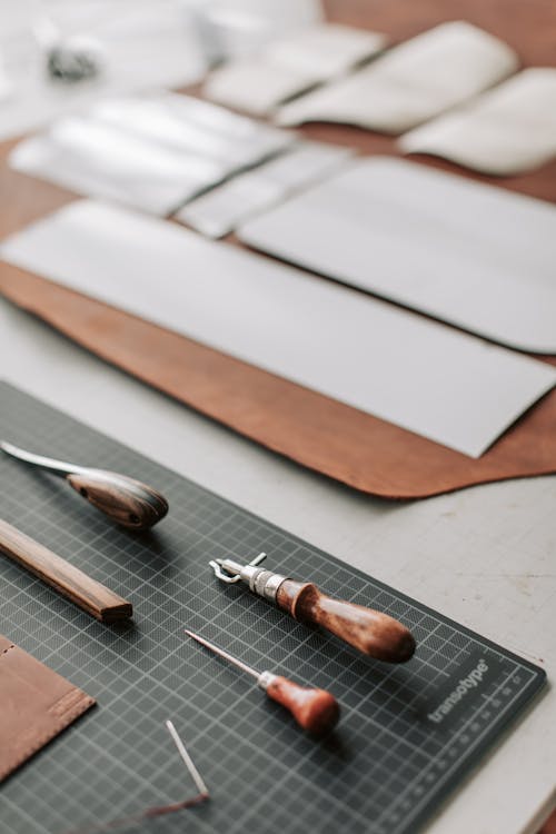 Leather and Tools for Leather Crafting Lying on a Desk 