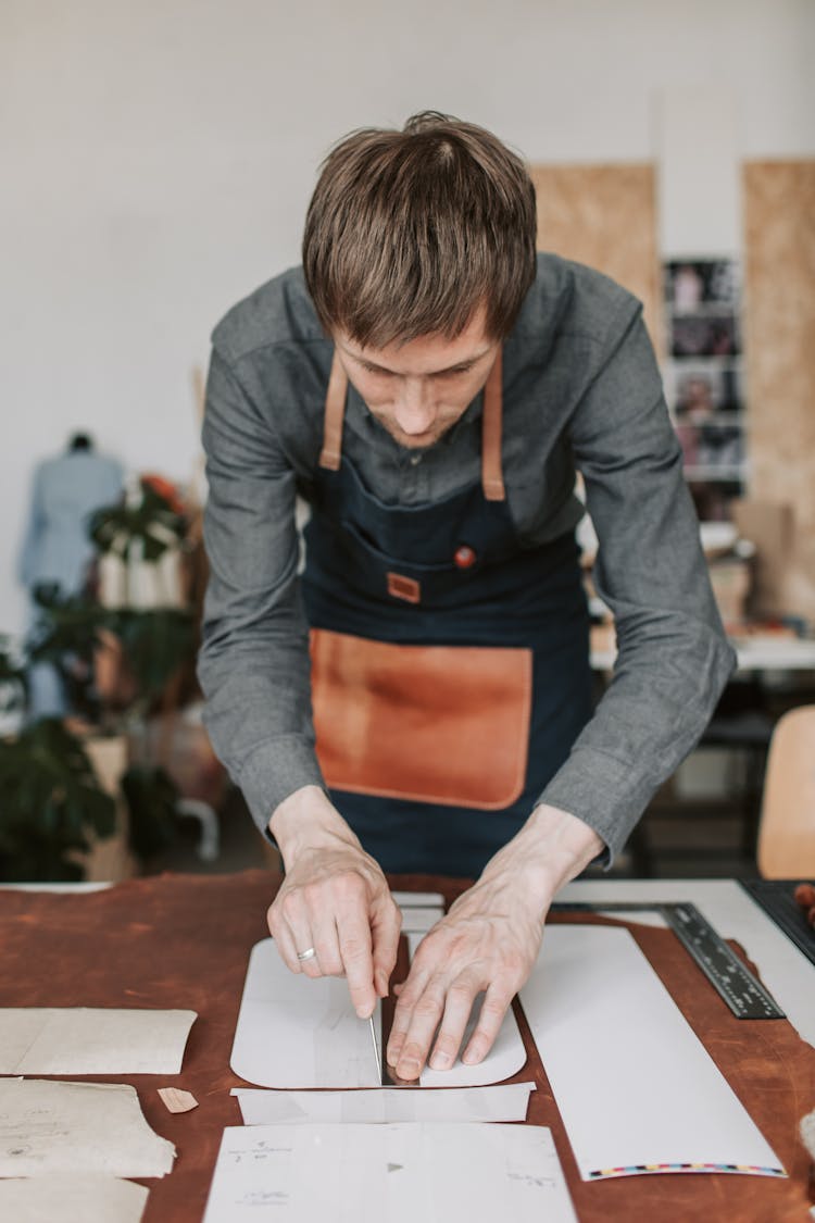 
A Man Cutting Leather