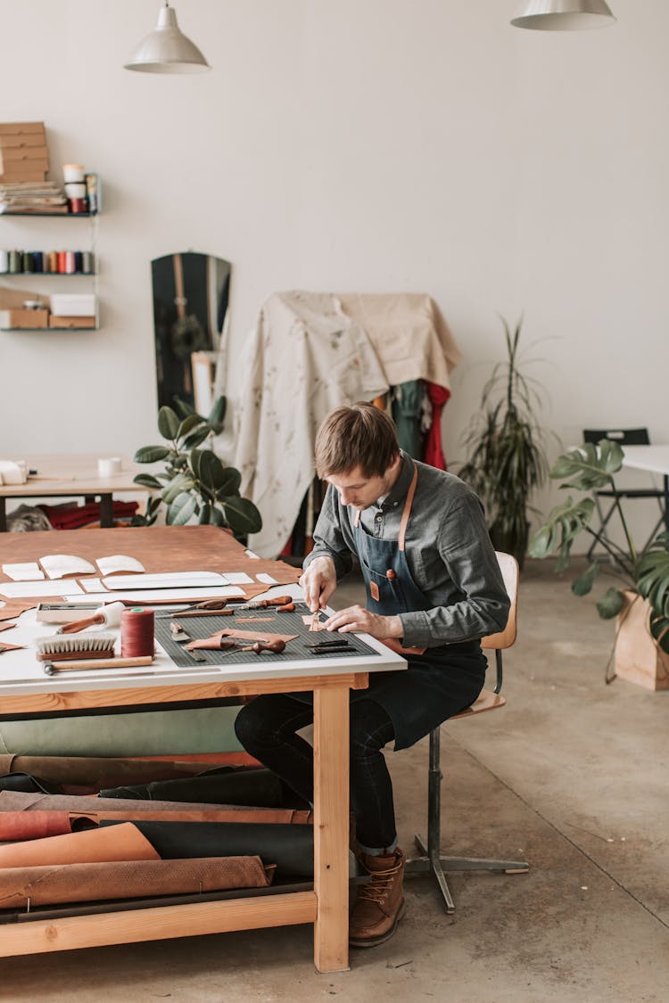 
A Man Cutting Leather