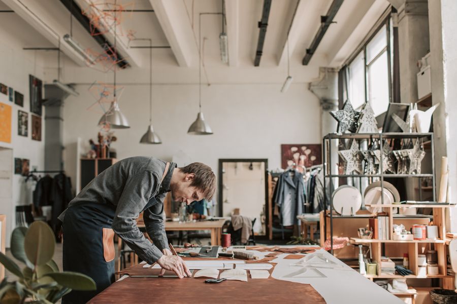 Leather cutting process at a manufacturing workbench