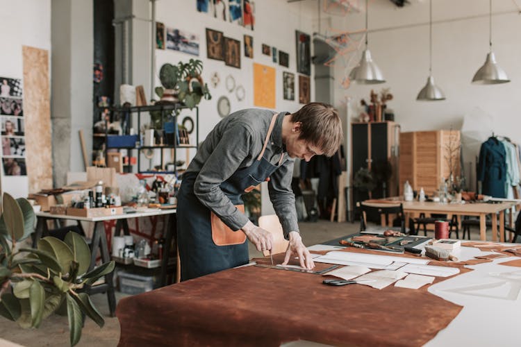 
A Man Cutting Leather