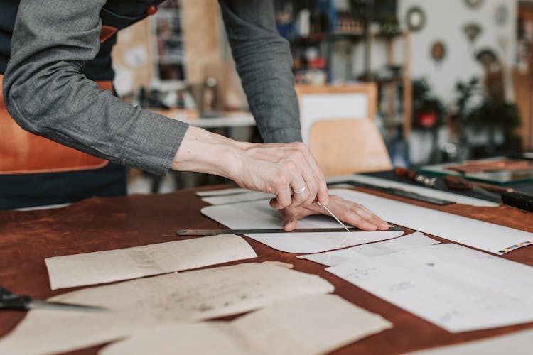 A Person Cutting Leather