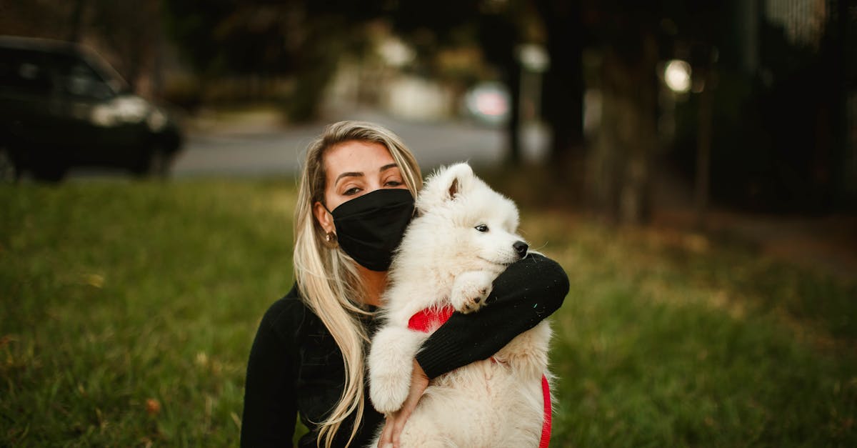 Serene woman hugging cute dog in city
