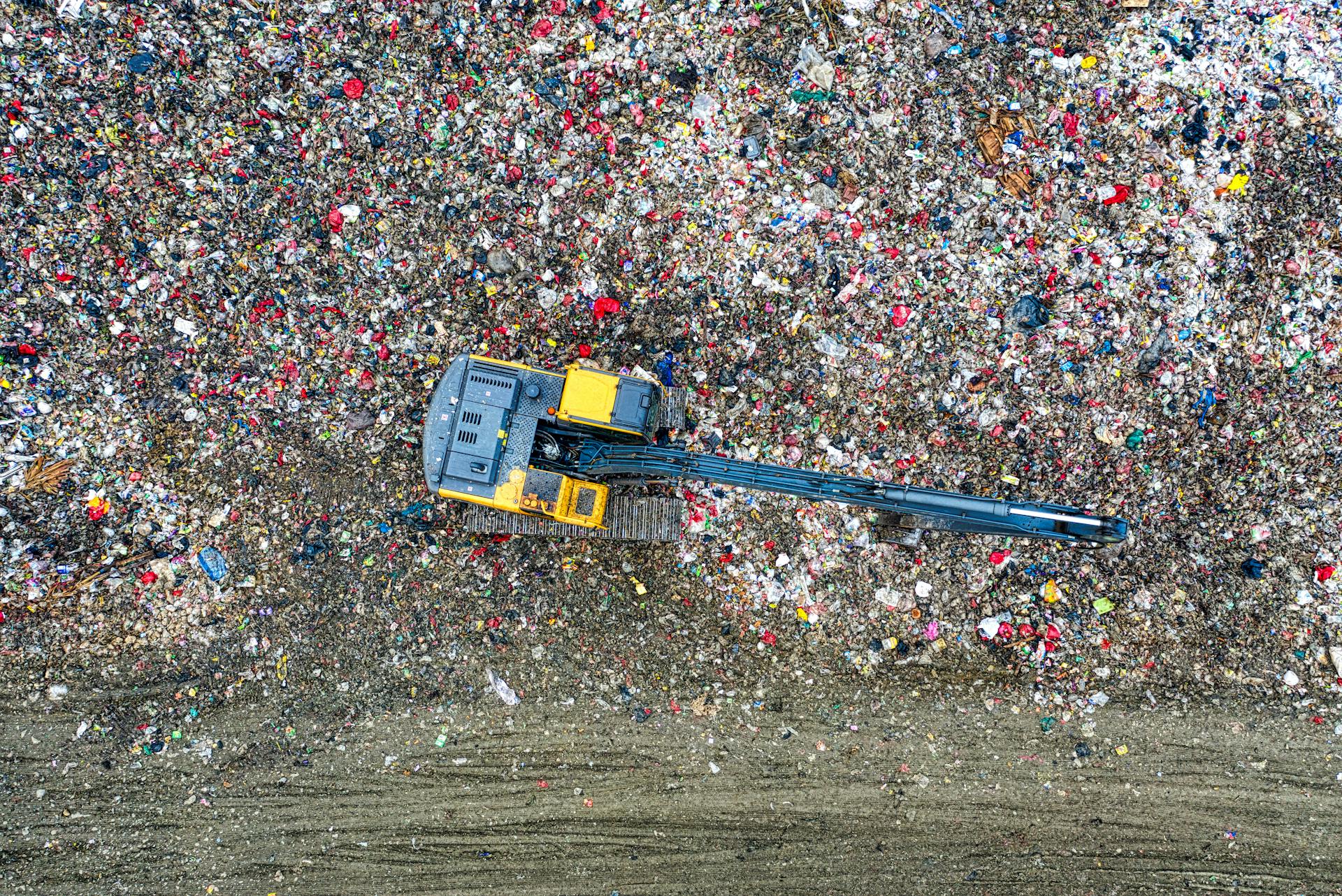 Top View of an Excavator of a Garbage Dump