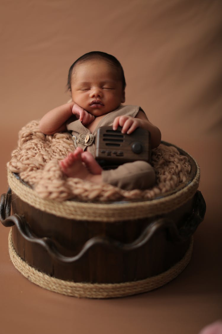 Newborn Sleeping On Basket