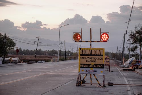 Warning signboard on city road during construction