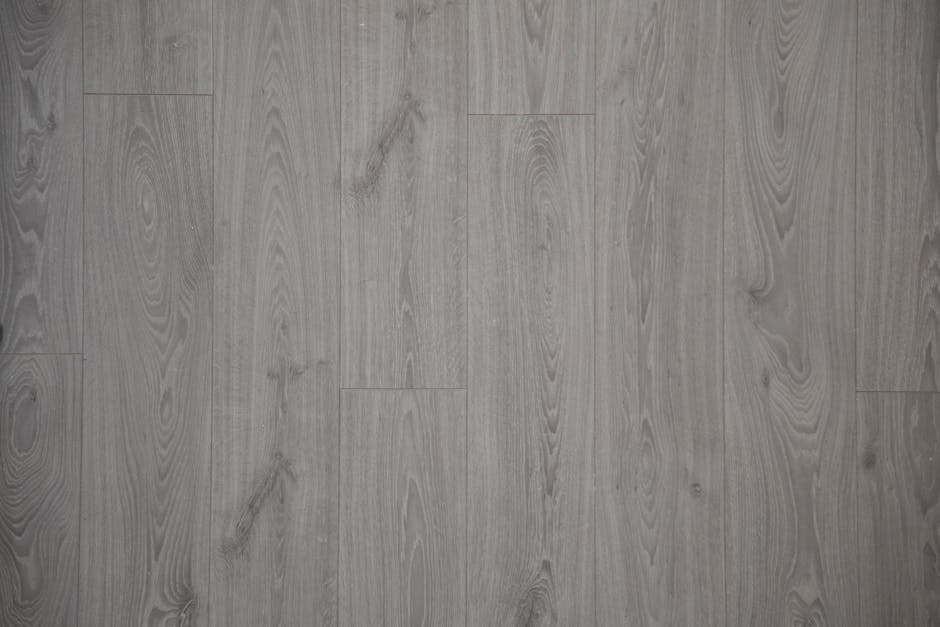 Close-up view of gray wooden floor planks with natural texture and pattern.