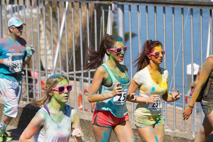 People Running With Paint Stains