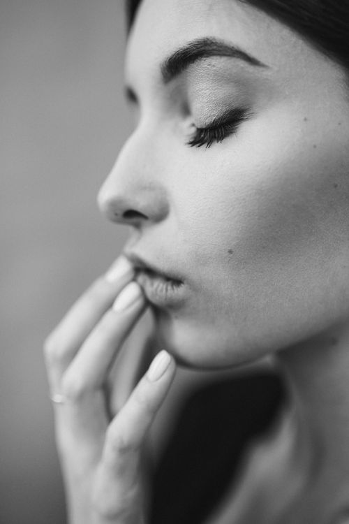 Free Monochrome portrait of a woman with closed eyes and thoughtful expression. Stock Photo
