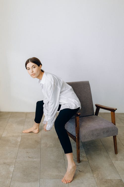 Photo of Woman sitting on a Chair