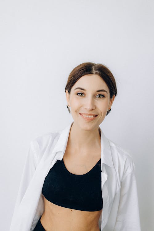 Woman in Black Tank Top and White Blazer