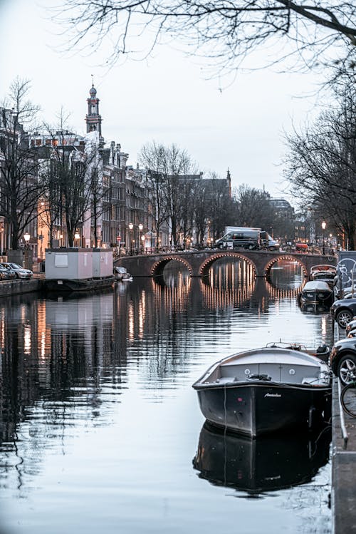 Black Boat Docked on the River