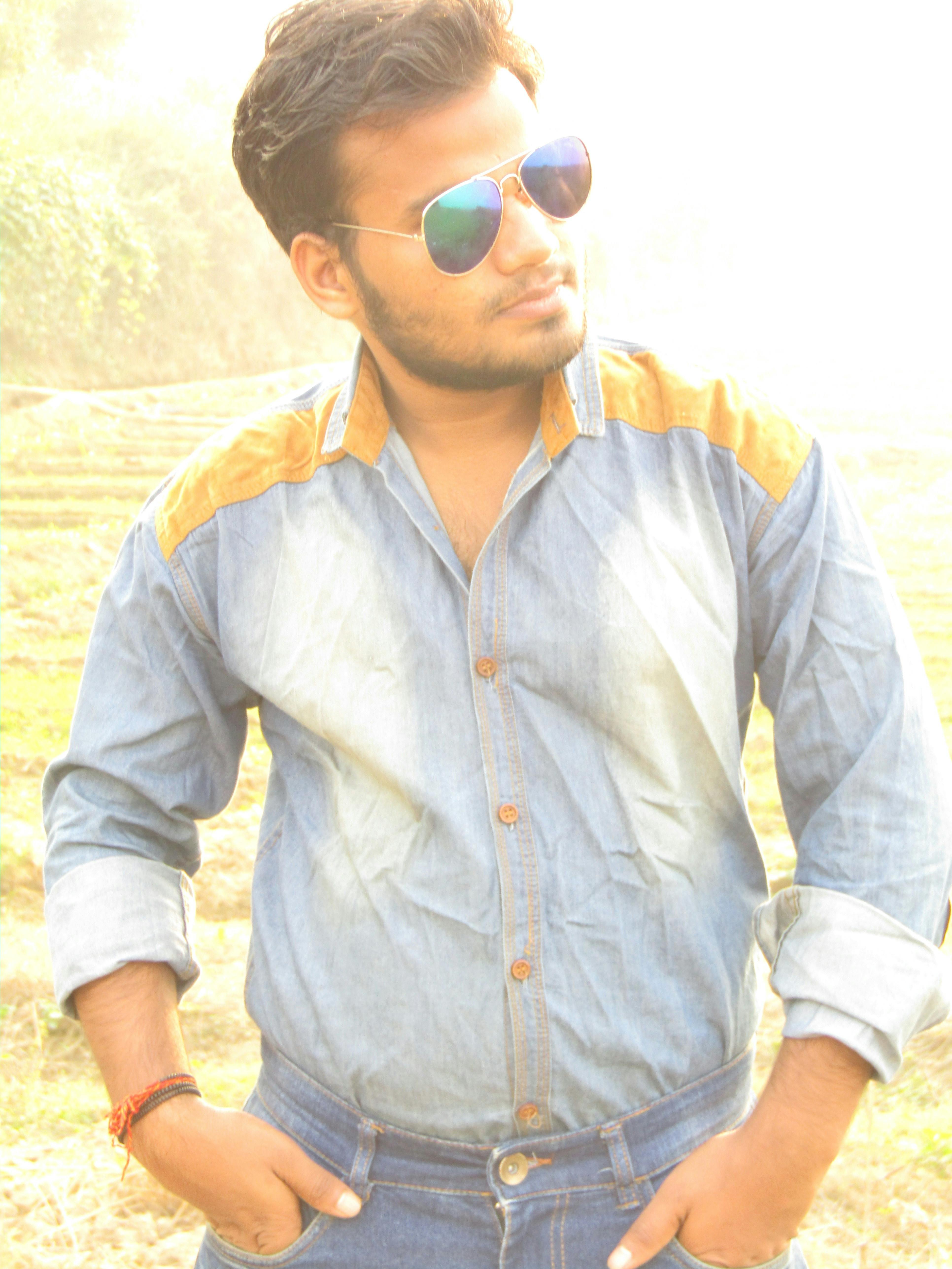 Hands out a car window in motion at golden hour