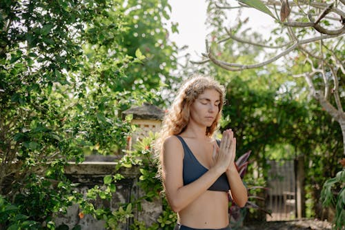 Pretty Woman Wearing Sports Bra in the Garden