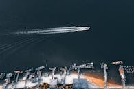 Motor boat sailing on sea near city port