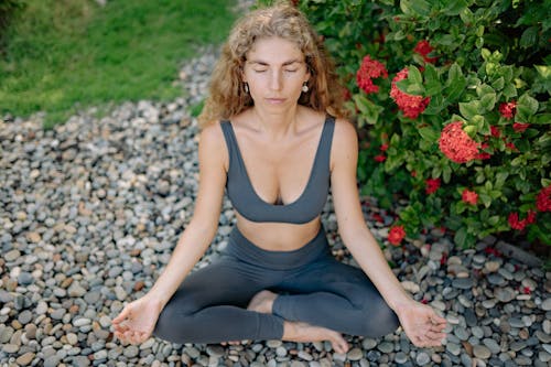 Woman in Yoga Position in the Garden