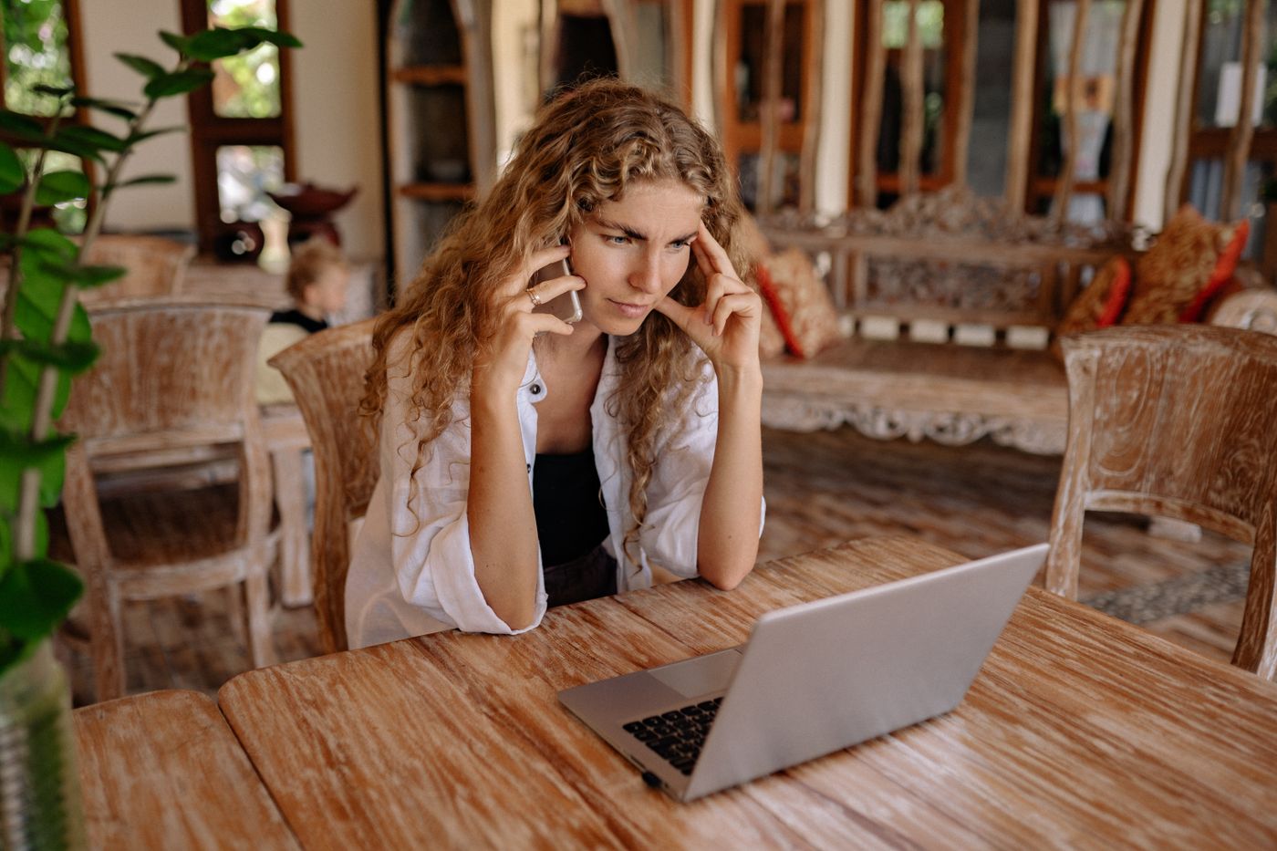 Serious woman reading a message on her phone