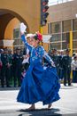 Woman in Blue Dress Wearing White Floral Headdress