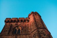 Brown Brick Building Under Blue Sky