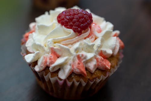 White and Red Icing Covered Cupcake