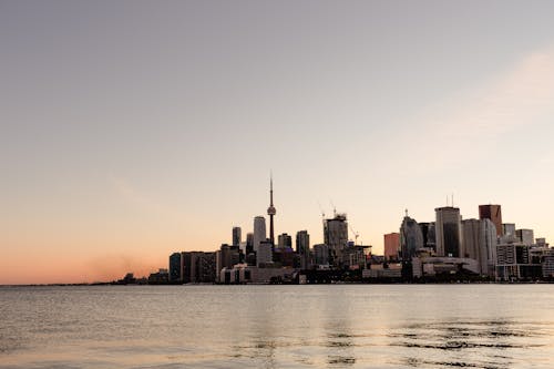 City Skyline during Sunset Near Body of Water