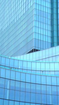 From below exterior of contemporary business center glass tower located in city downtown