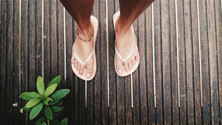 A Person Wearing A Flip Flops