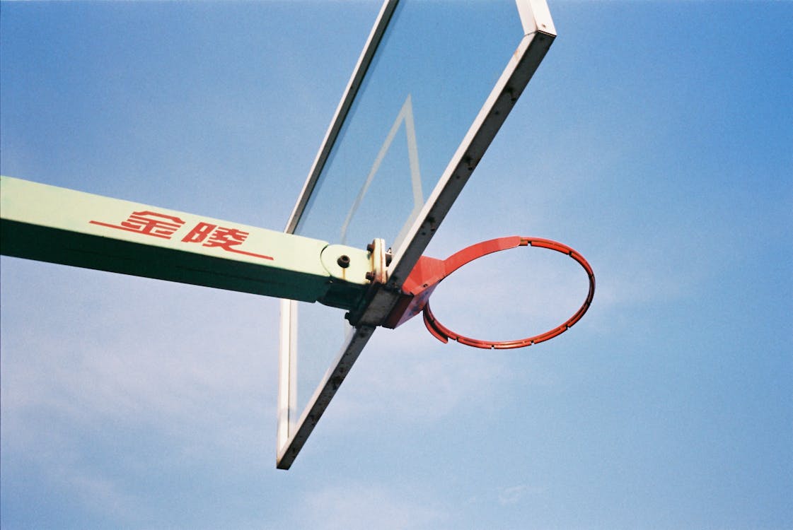 Free Red and White Basketball Hoop Under Blue Sky Stock Photo