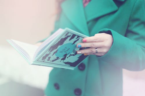 Woman Holding Peter Pan Book