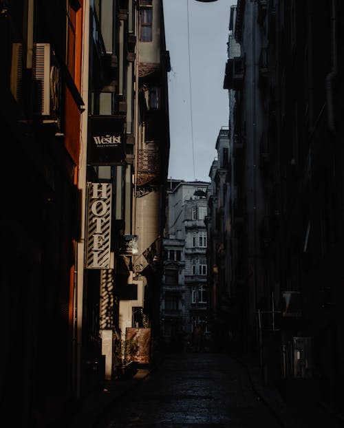 Empty street amidst aged buildings at dawn