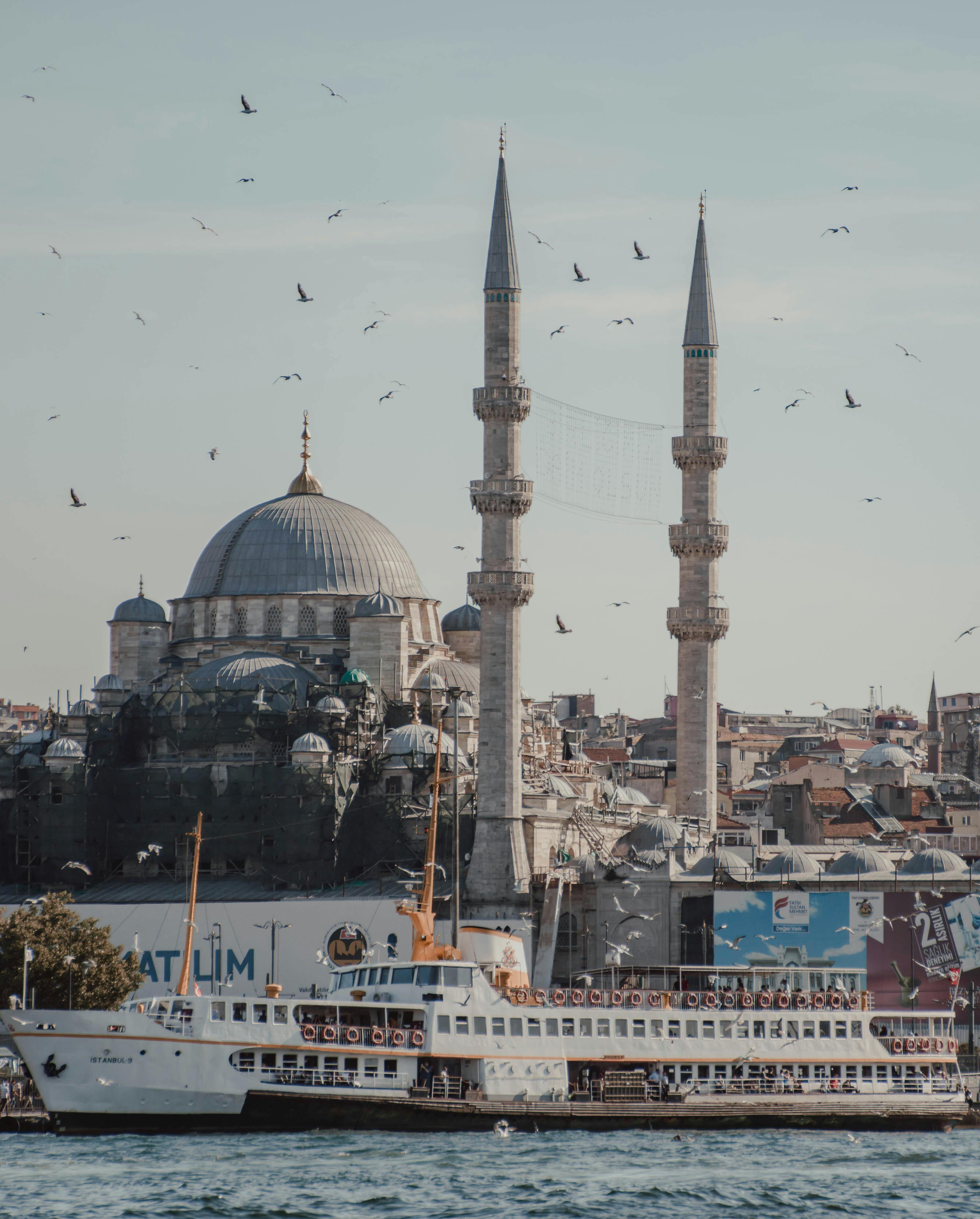 historical mosque at waterfront on sunny day