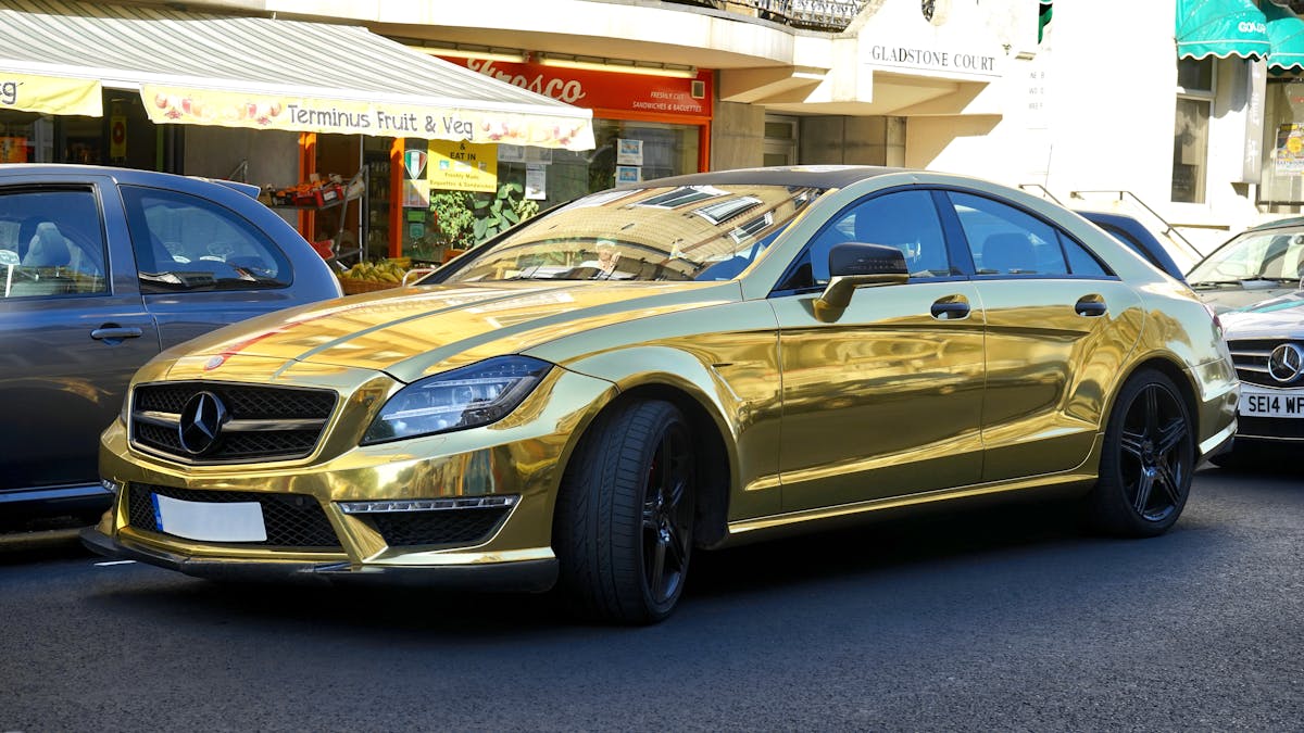 Gold Mercedes-benz Sedan on Road