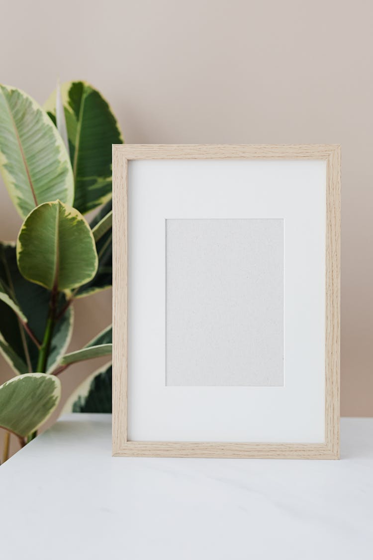 Empty Picture Frame Standing On Desk