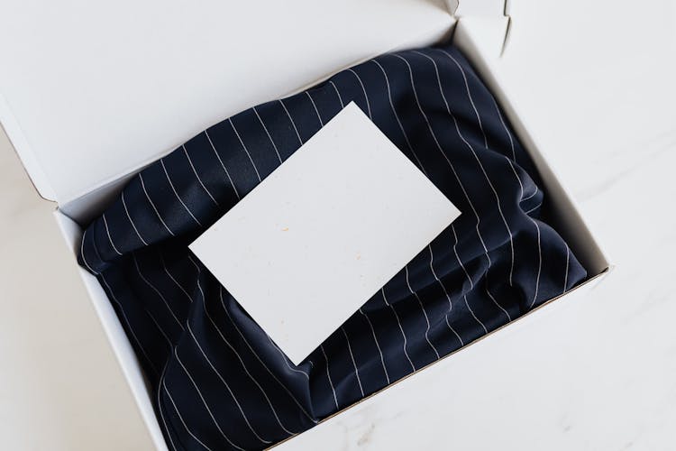 Silk Navy Blue Clothing In White Box With Card On Top