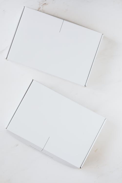 Two Boxes on a White Surface