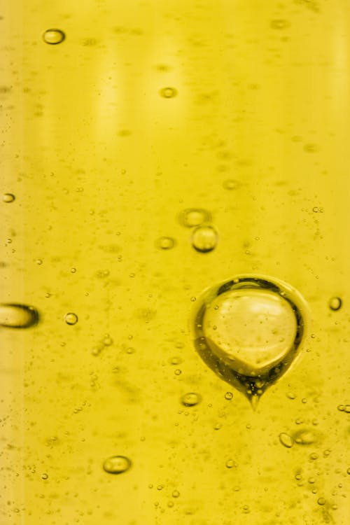 無料 泡, 液体, 黄色の背景の無料の写真素材 写真素材