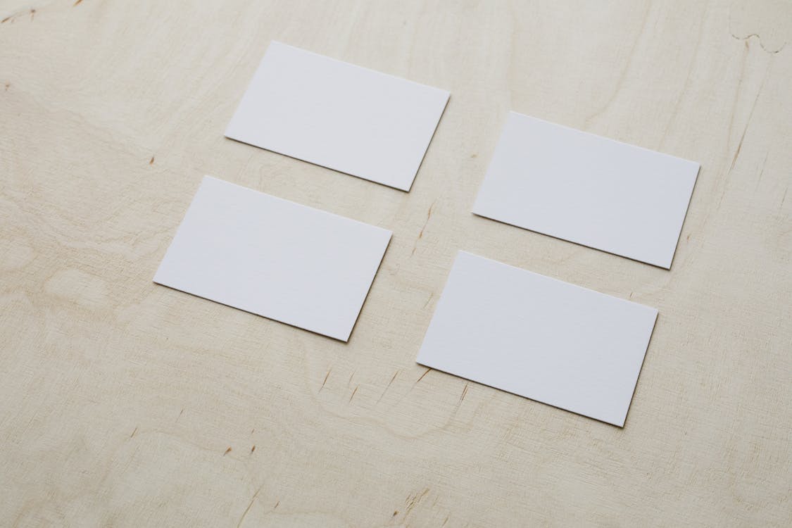 Clean white visiting cards on wooden surface