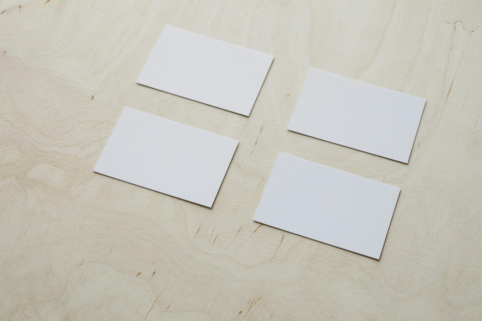 Clean white visiting cards on wooden surface