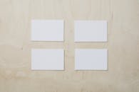 Empty white business cards on wooden table