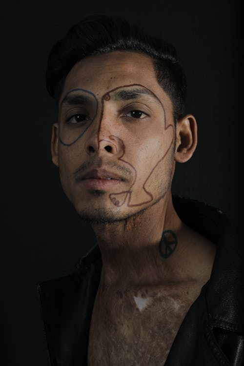 A Man with Drawing on His Face