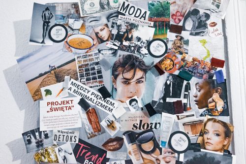 Free Pictures and articles from fashion magazines arranged in collage and hanging on wall Stock Photo