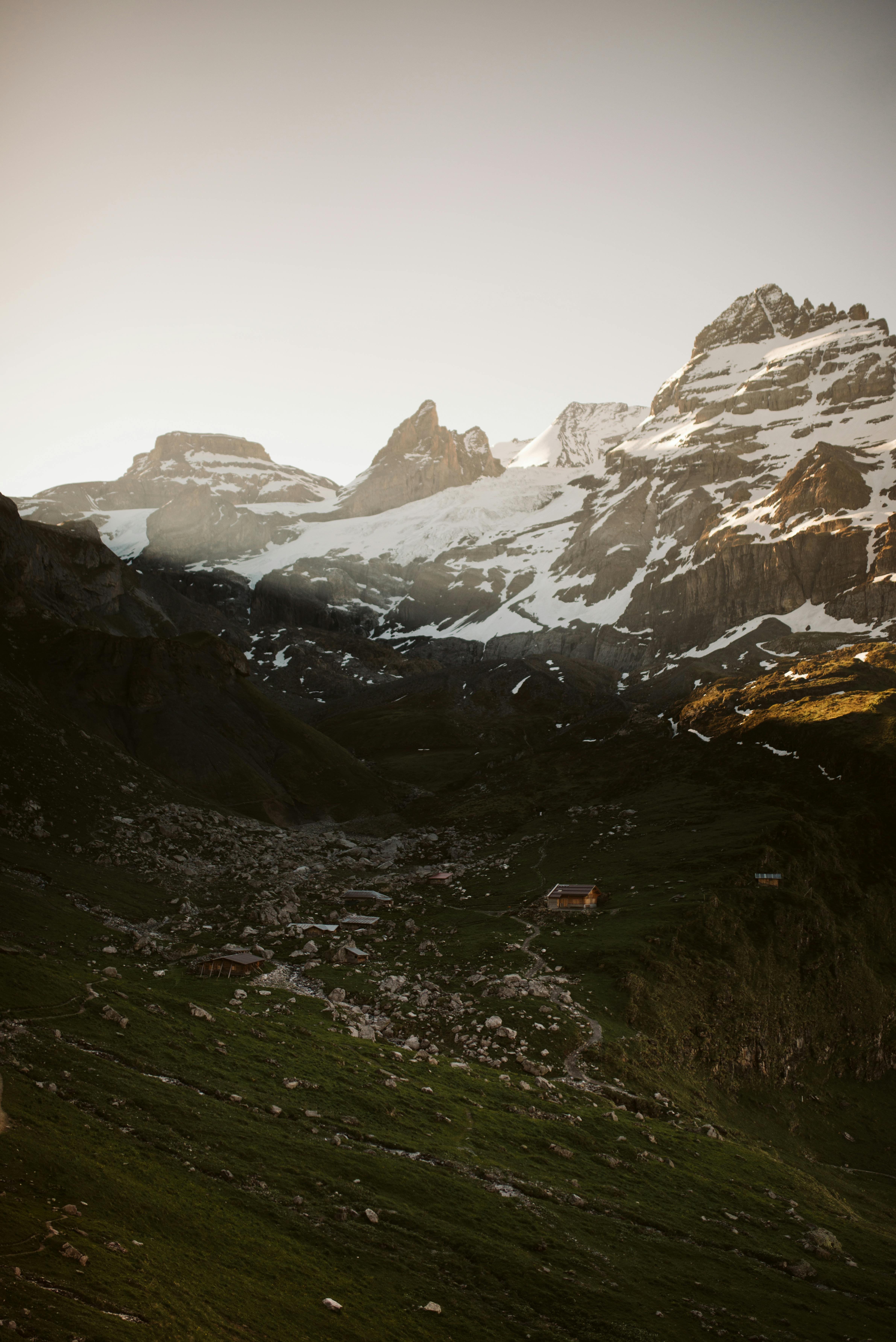 Snowy mountains on gray day · Free Stock Photo