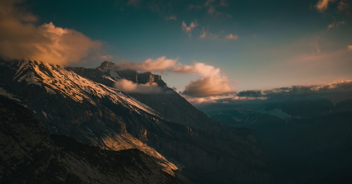 Cloud On Ridges Clouds over mountain ridge in morning · Free Stock Photo